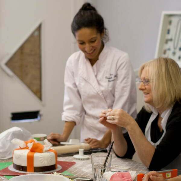 photo of instructor and participant at our baking day experience event