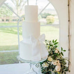 Three tiered white wedding cake at Vanilla Pod Bakery at Karma Salford Hall