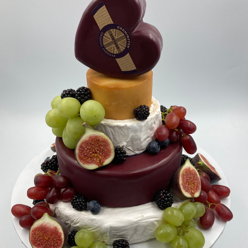 Cheese stack decorated with fresh fruit