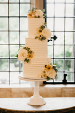 Three tiered buttercream wedding cake image by Kevin Fern Photography - Cake by Vanilla Pod Bakery
