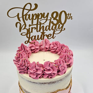 Pink birthday cake with bespoke topper